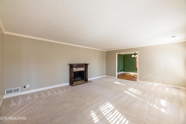 unfurnished living room featuring crown molding, a premium fireplace, and light carpet