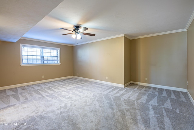 carpeted empty room featuring crown molding and ceiling fan