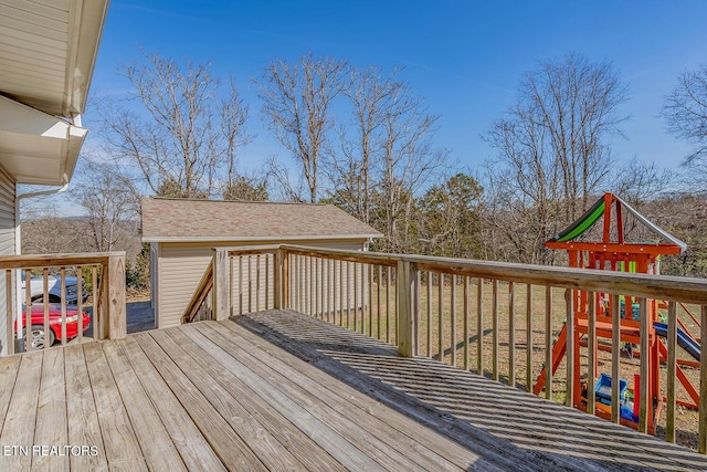 wooden terrace featuring a playground