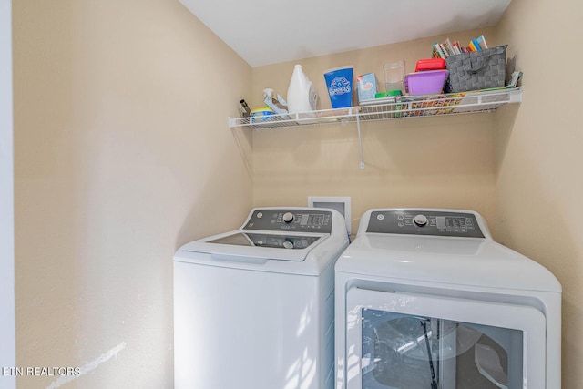 laundry room featuring washing machine and dryer