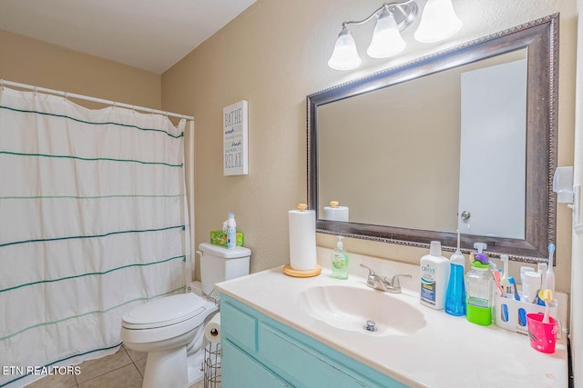 bathroom with tile patterned flooring, vanity, a shower with shower curtain, and toilet