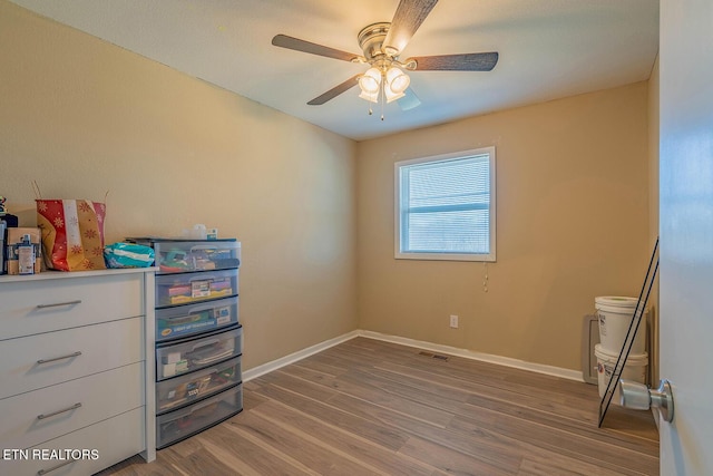 bedroom with wood-type flooring and ceiling fan