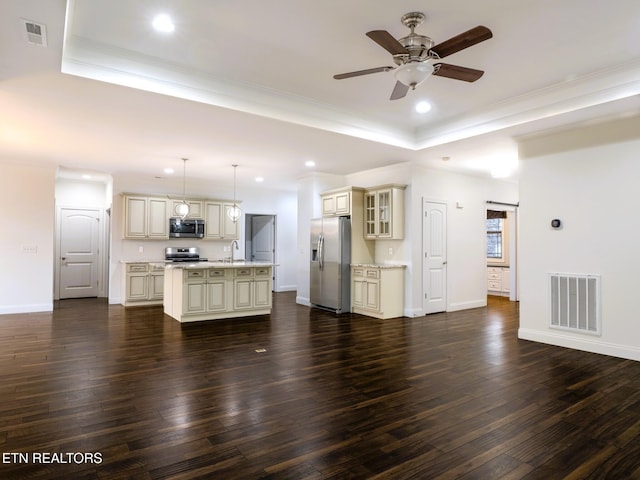 unfurnished living room with dark hardwood / wood-style flooring, ornamental molding, a raised ceiling, and ceiling fan