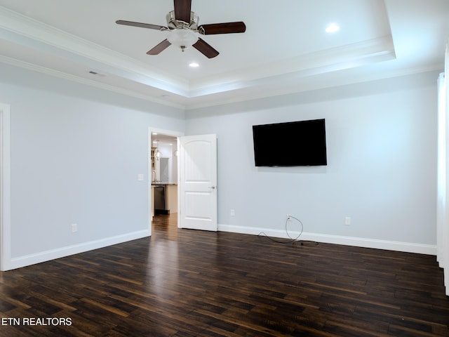 unfurnished living room with dark hardwood / wood-style flooring, ornamental molding, a raised ceiling, and ceiling fan