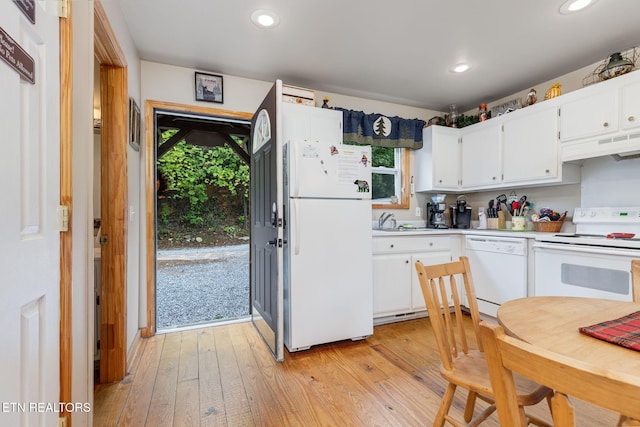 kitchen with white cabinetry, white appliances, sink, and light wood-type flooring