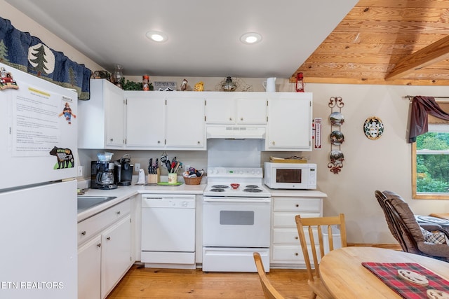 kitchen with white cabinetry, sink, and white appliances