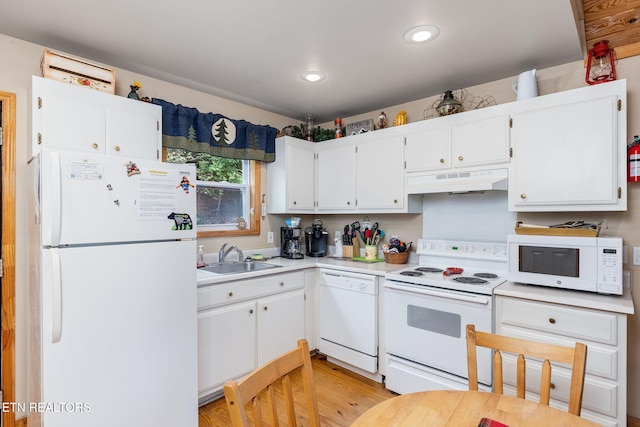 kitchen featuring white cabinetry, white appliances, and sink