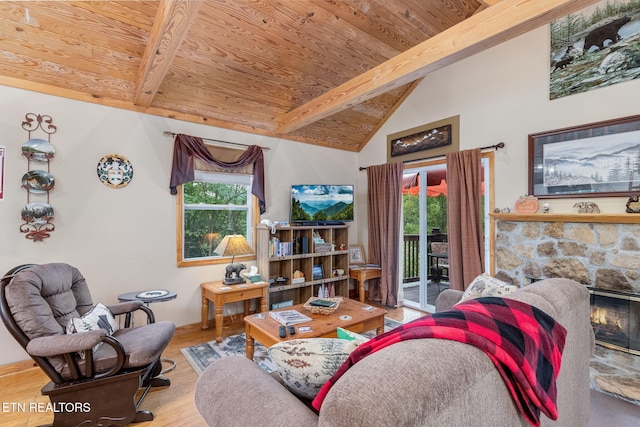 living room featuring wood ceiling, plenty of natural light, and beam ceiling