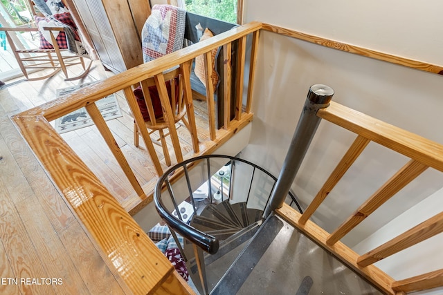 stairway featuring hardwood / wood-style flooring