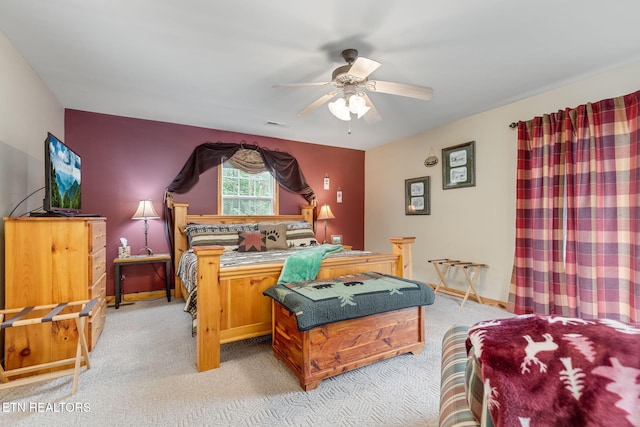 bedroom with ceiling fan and carpet flooring