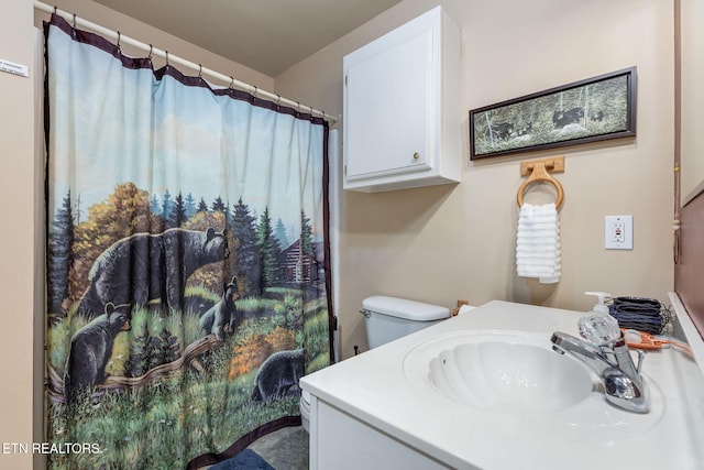 bathroom with vanity and toilet