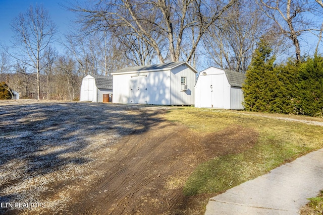 view of outdoor structure with a lawn