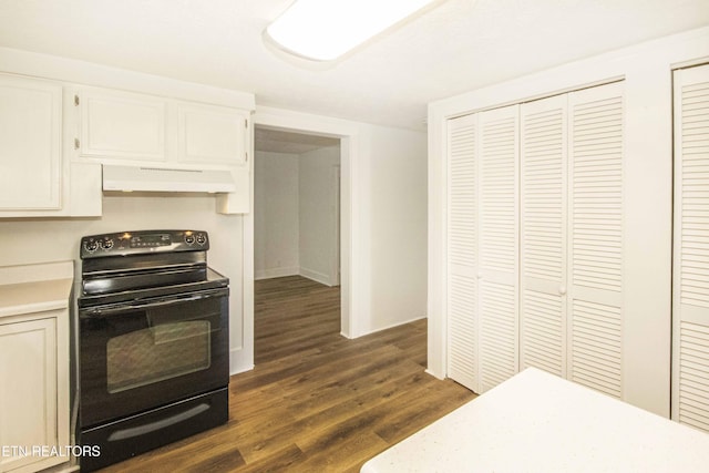 kitchen featuring dark hardwood / wood-style flooring, black electric range oven, and white cabinets