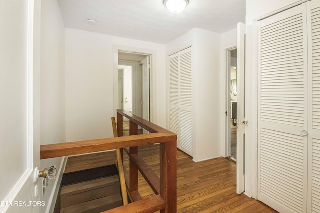 hallway with dark hardwood / wood-style floors