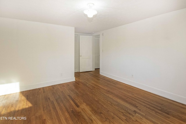 empty room featuring hardwood / wood-style floors