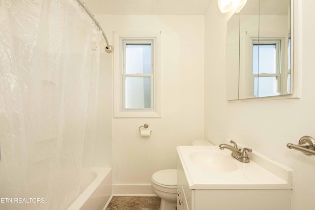 full bathroom featuring vanity, shower / bath combination with curtain, and toilet