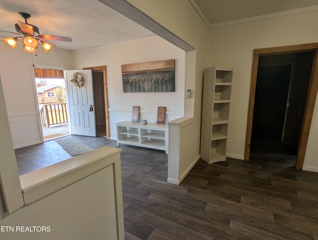 entrance foyer with crown molding, ceiling fan, and dark hardwood / wood-style flooring