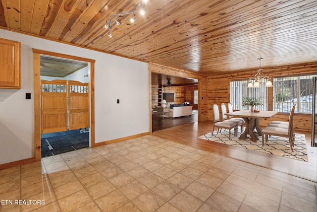 tiled dining area featuring wood walls, a chandelier, and wooden ceiling