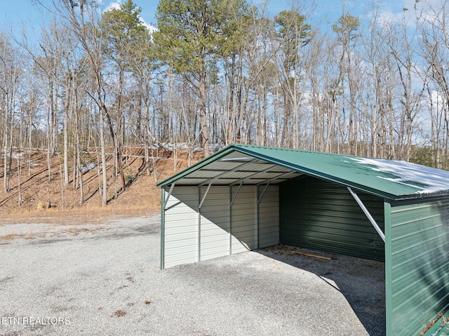 view of outbuilding with a carport