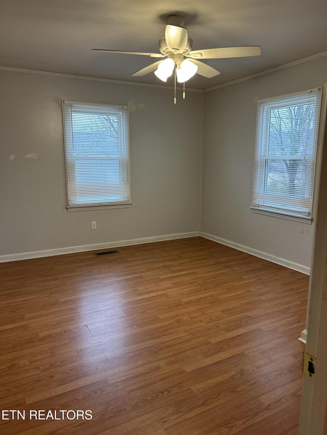 unfurnished room featuring crown molding, ceiling fan, and hardwood / wood-style flooring