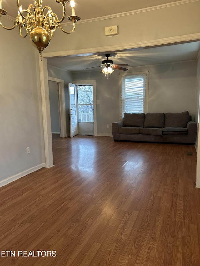 unfurnished living room with ornamental molding, ceiling fan with notable chandelier, and dark hardwood / wood-style flooring