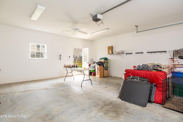 garage featuring ceiling fan and a garage door opener