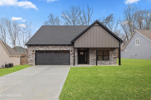 view of front of home featuring a garage, central AC, and a front yard