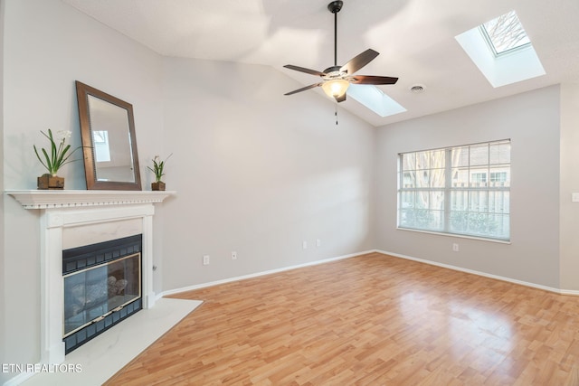 unfurnished living room featuring vaulted ceiling, hardwood / wood-style floors, and ceiling fan