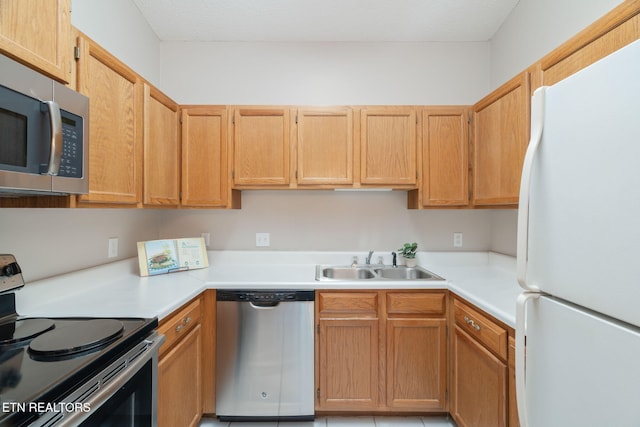 kitchen featuring appliances with stainless steel finishes and sink