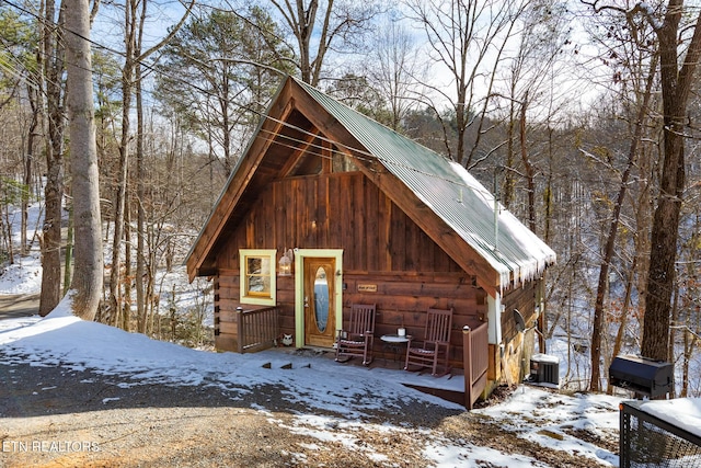 view of front of house featuring cooling unit