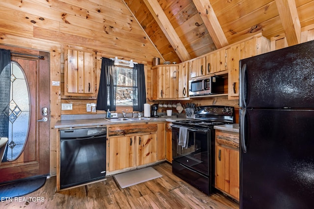 kitchen featuring sink, vaulted ceiling with beams, wood ceiling, hardwood / wood-style floors, and black appliances