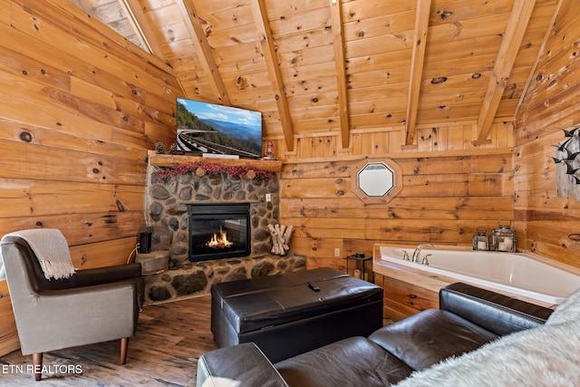 living room featuring wood ceiling, wooden walls, lofted ceiling with beams, and hardwood / wood-style floors