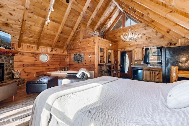 bedroom featuring a fireplace, hardwood / wood-style flooring, black fridge, wooden ceiling, and beam ceiling