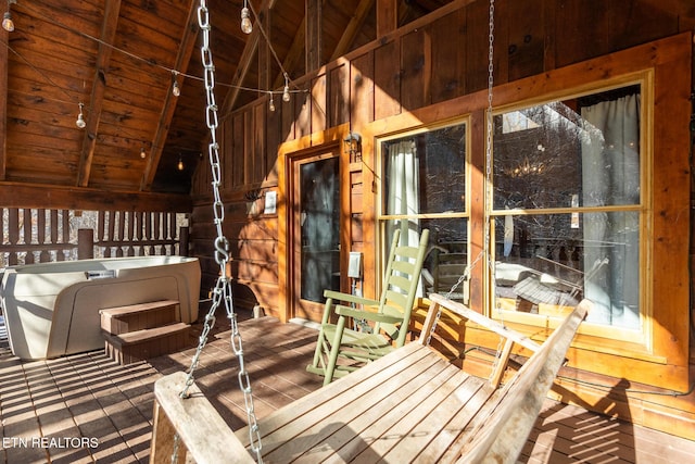 exterior space featuring wood ceiling, wooden walls, high vaulted ceiling, and beamed ceiling