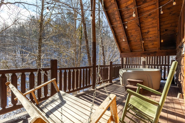 deck featuring a hot tub