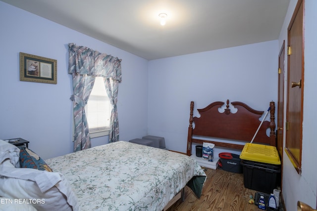 bedroom featuring wood-type flooring