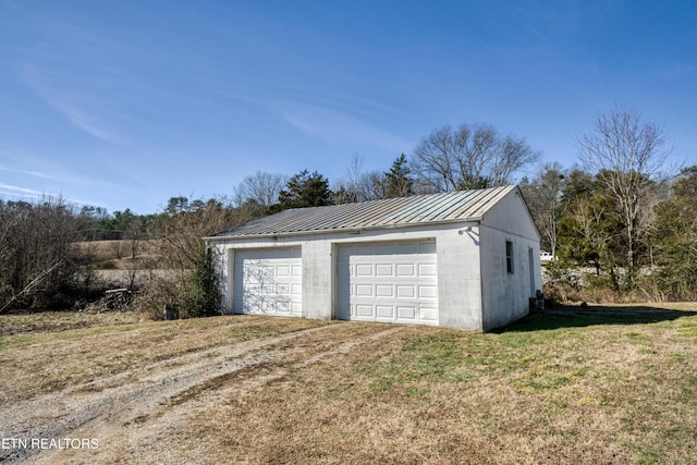 garage with a lawn