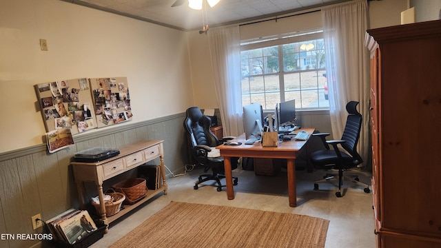 office space featuring ceiling fan and ornamental molding