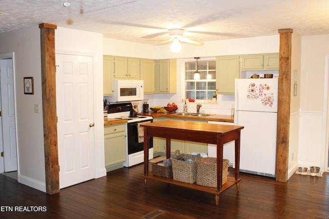 kitchen featuring sink, white appliances, dark hardwood / wood-style floors, and green cabinets