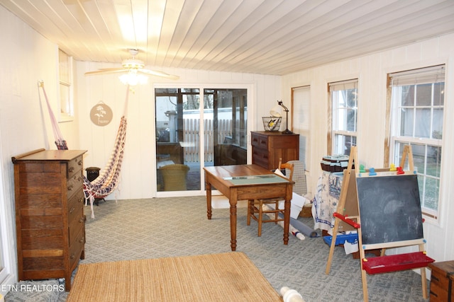 carpeted dining room featuring wooden ceiling and ceiling fan