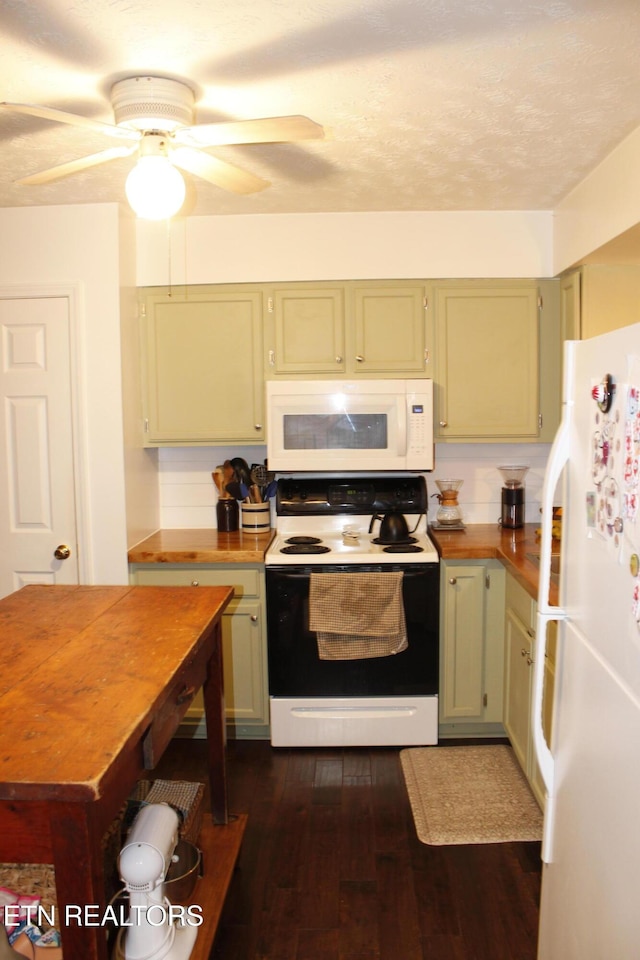 kitchen featuring white appliances, dark hardwood / wood-style flooring, a textured ceiling, and green cabinetry