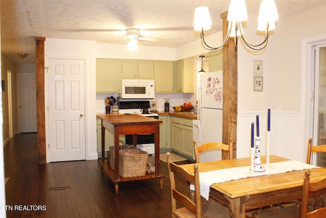 kitchen featuring ceiling fan with notable chandelier, dark hardwood / wood-style flooring, hanging light fixtures, green cabinets, and white appliances