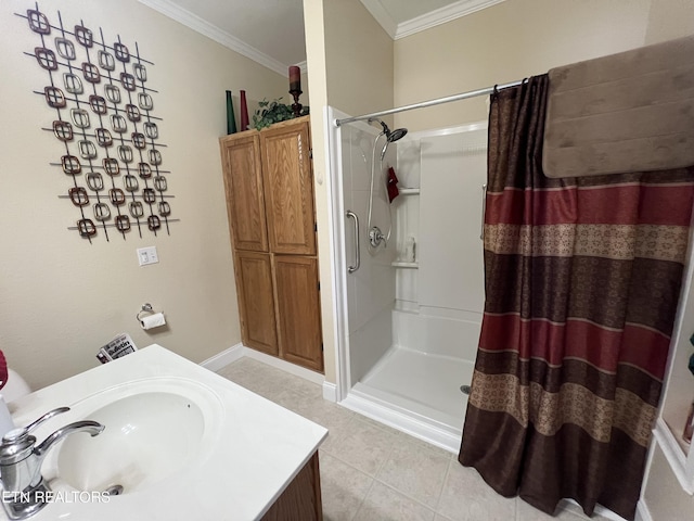 bathroom featuring sink, tile patterned floors, ornamental molding, and walk in shower