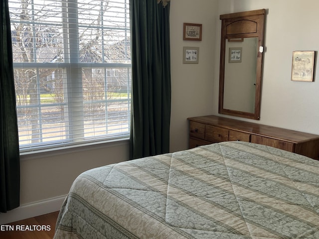 bedroom featuring hardwood / wood-style flooring