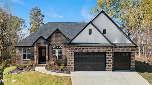 view of front of home featuring an attached garage, driveway, a shingled roof, and brick siding