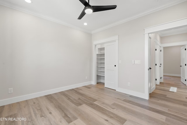 unfurnished bedroom with light wood finished floors, baseboards, and crown molding