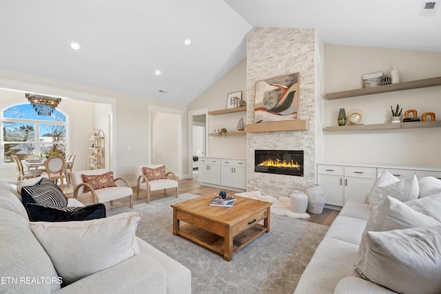 living area with light wood finished floors, a fireplace, visible vents, and recessed lighting