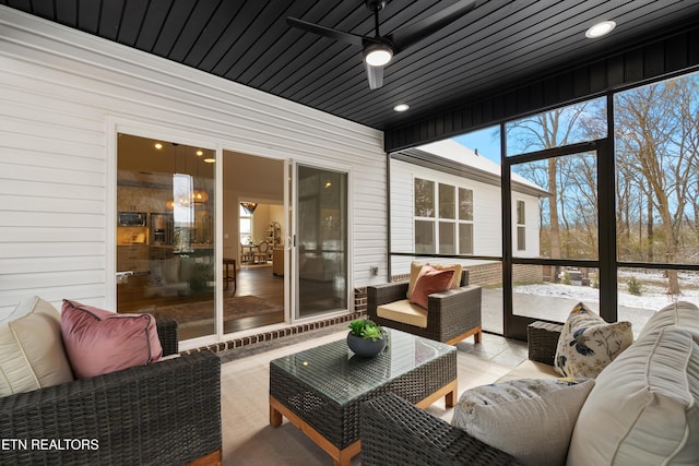 sunroom / solarium with ceiling fan