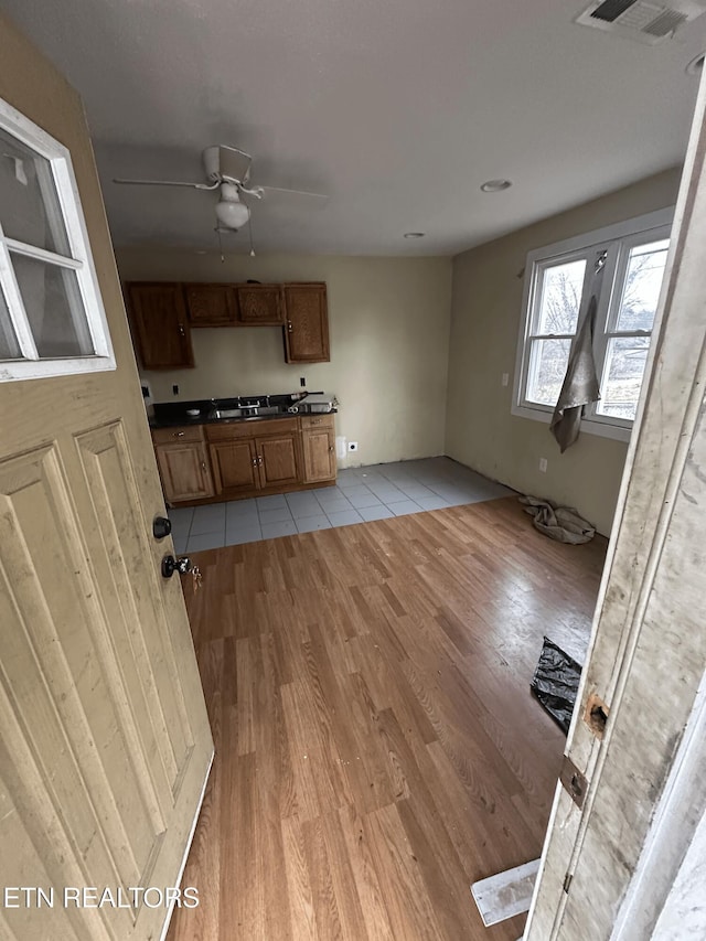 kitchen with ceiling fan and light tile patterned floors