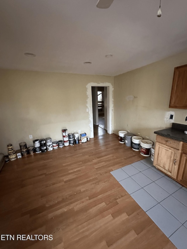 unfurnished dining area featuring light wood-type flooring